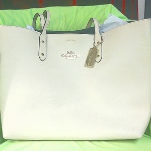 A cream coach bag never been used